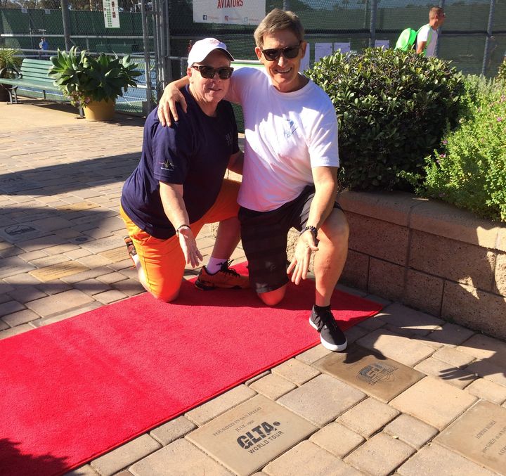 GLTA President Dan Merrithew with the GLTA’s first Commissioner, Scott Williford, unveiling the brick commemorating the founding of the GLTA in San Diego in 1991.