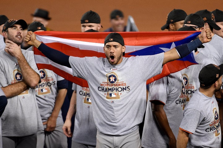 Correa celebrates winning the World Series.