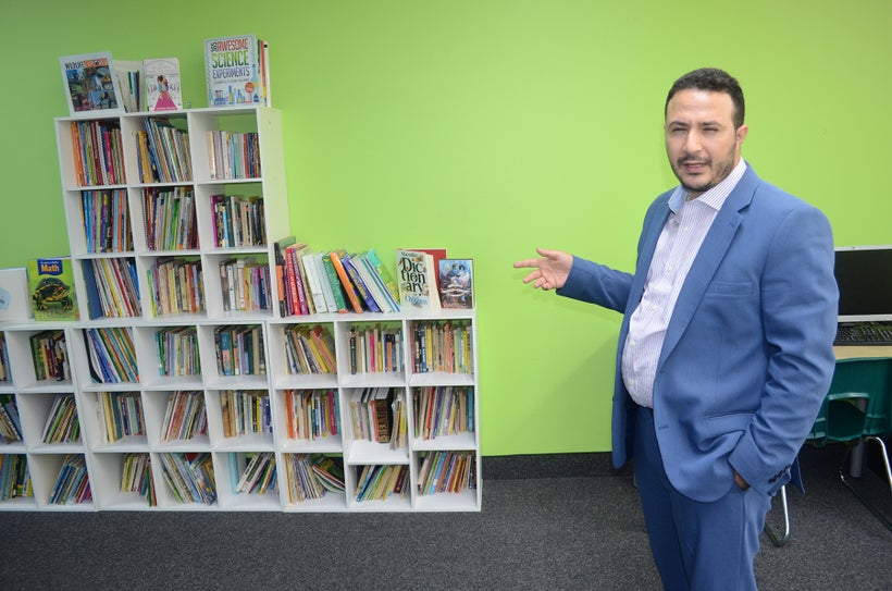 Hussein Hachem of Dearborn, Mich. shows off his Educare tutoring facility called ‘Educare.’ Many of the books were purchased