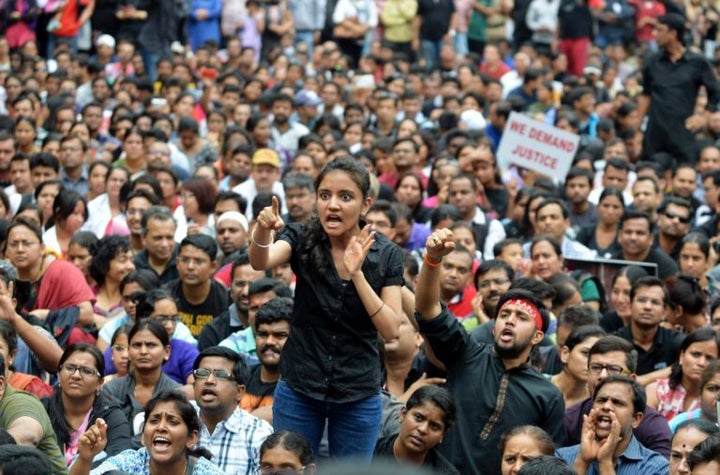 A demonstrator shouts slogans during a protest against rape in Bangalore, India. 2014 