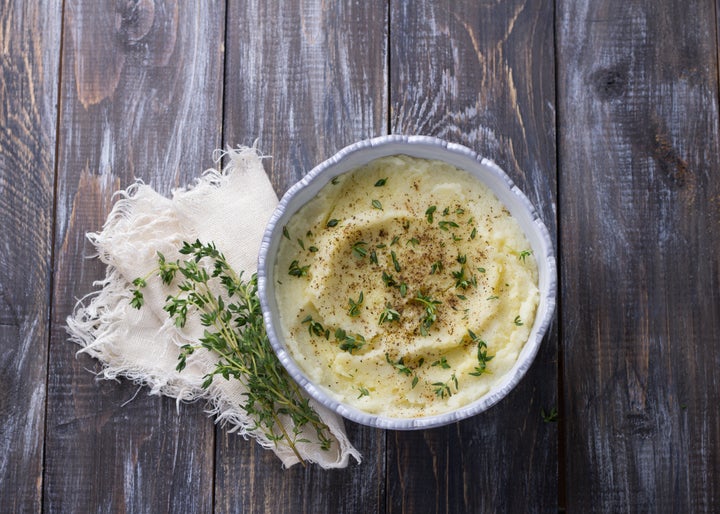 Surprise! These aren't potatoes. Mashed cauliflower is ridiculously easy to make, especially when you <a href="https://www.amazon.com/food-processors/b?ie=UTF8&node=289920" target="_blank">let your food processor do the work</a>. 