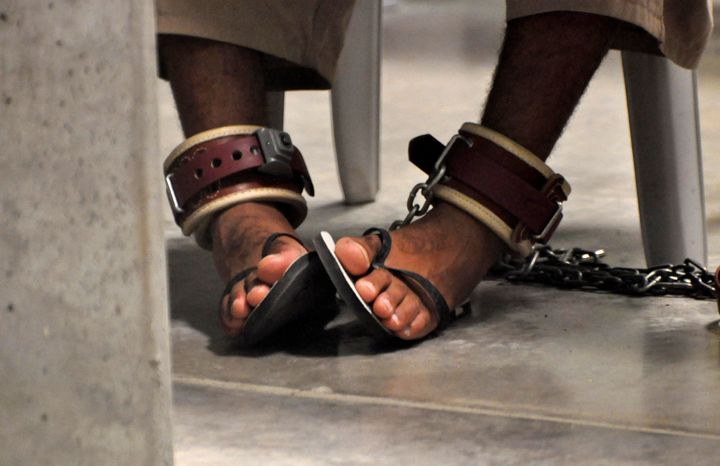 An inmate shackled to the floor as he attends a 'Life Skills' class.