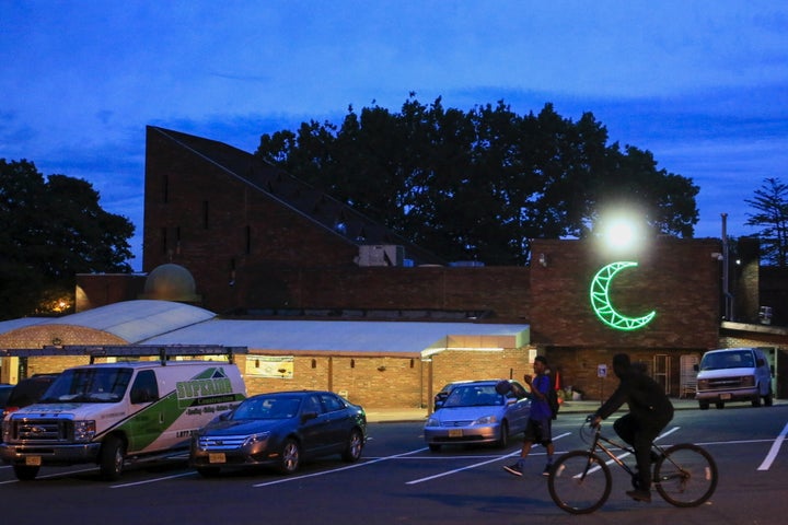 People walk by the Islamic Center of Passaic County in Paterson, New Jersey, which has the second-largest Muslim co