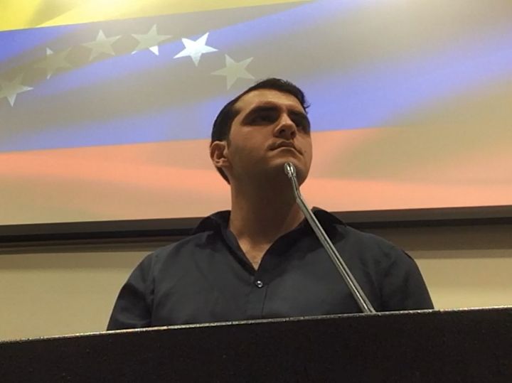 Jorge speaking at a campus event about the atrocities of the Maduro regime.