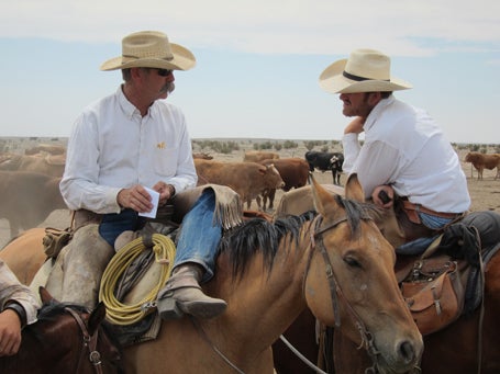 Duke & Duke Philips, talking shop on the Ranch. 