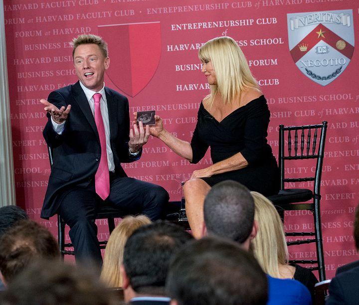 International Best Selling Authors John Rankins and Suzanne Somers share a moment when John reveals an image of his unborn son at the Business Expert Forum at Harvard Faculty Club. 