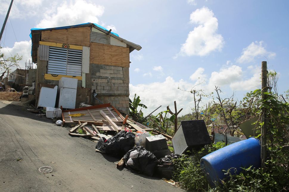 Debris gathers on the streets in Canóvanas, Puerto Rico on Oct. 14, 2017.