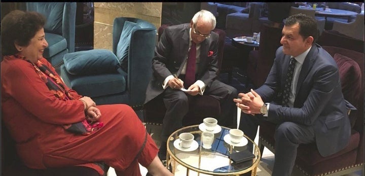<p>Norwegian-Kashmiri Ali Shahnawaz Khan (right) with a foreign dignitary in Oslo, Norway.</p>