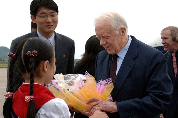<em>Former President Carter Arrives in Pyongyang to Negotiate Release of American Prisoner.</em>