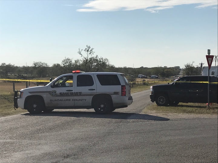 Police block a road in Sutherland Springs, Texas, after a gunman shot dozens of people at a nearby church on Sunday. Sut