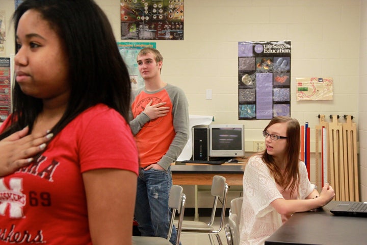 High School senior Sarah Baker chose to sit during the Pledge of Allegiance at Millard West High School in Omaha, Nebraska. 