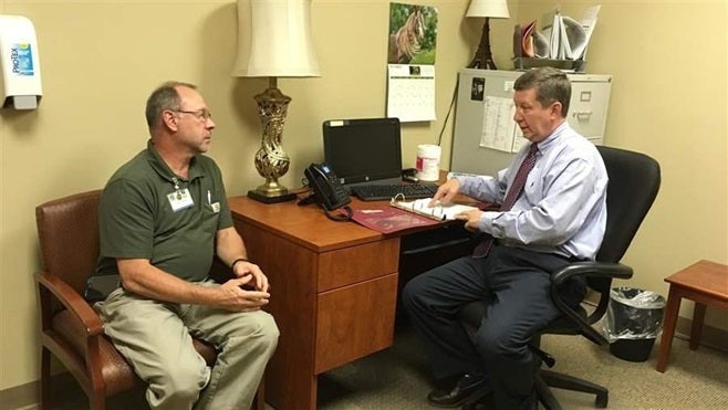 Dr. Michael Wilkerson discusses a patient’s case with a nurse at a Bradford Health Services addiction treatment facility in Warrior, Alabama. When doctors become addicted to drugs or alcohol, confidential state programs must balance doctors’ welfare and patient safety.