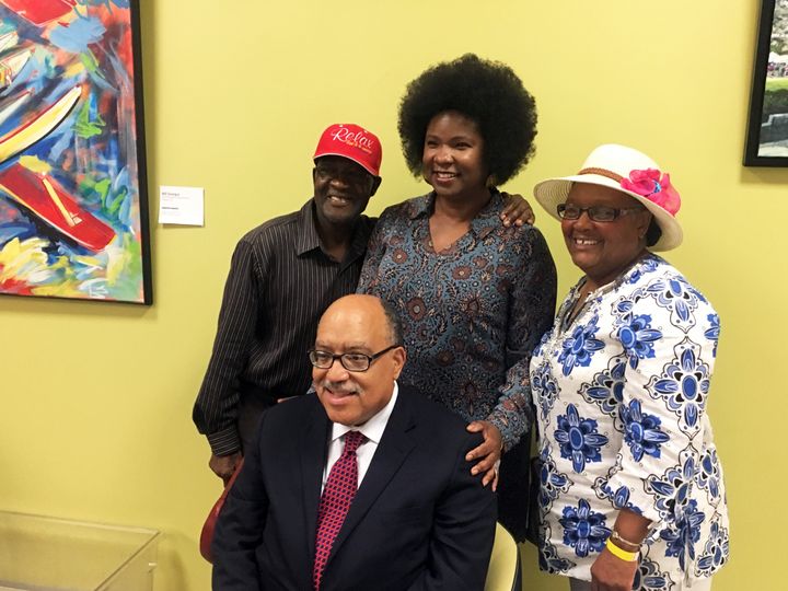 From left to right, Robert Darden, Tanya Washington and Bertha Darden pose with Fort after his first televised debate. The trio is part of a group of activists resisting a city eminent domain order in the Peoplestown neighborhood.