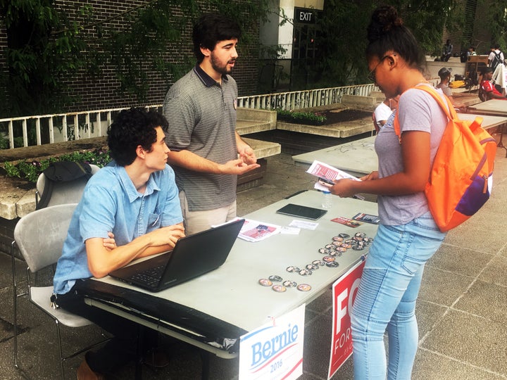 Jonathan Bo-o (left) and Matthew Golden (center) talk to a fellow student at Georgia State University about Fort's mayoral bid.