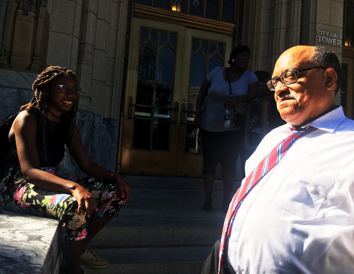 Fort speaks with Spelman College student Eva Dickerson, 20, outside Atlanta City Hall.