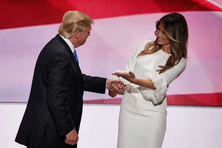 Then-Republican presidential nominee Donald Trump and wife Melania hold hands after she delivered a speech on the first day of the Republican National Convention on July 18, 2016 at the Quicken Loans Arena in Cleveland, Ohio.