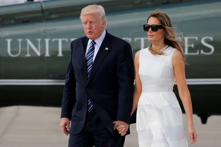 U.S. President Donald Trump and first lady Melania Trump hold hands as they arrive to board Air Force One for travel to Rome from Ben Gurion International Airport in Tel Aviv, Israel on May 23.