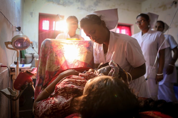 A midwife delivers a baby in Bangladesh.