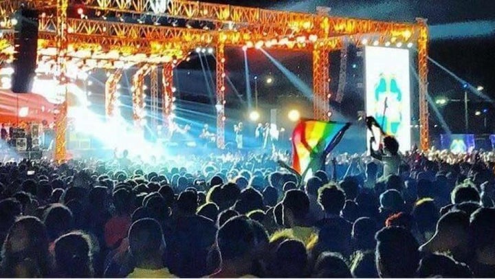 Young people wave a rainbow flag at a Cairo concert featuring the Lebanese band Mashrou’ Leila. Activist Ahmed Alaa confirmed that he raised a rainbow flag at the concert in a Buzzfeed video including this image prior to his arrest. 