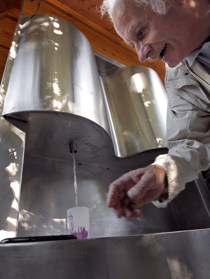 A man uses the original sparkling water fountain in 2010. 