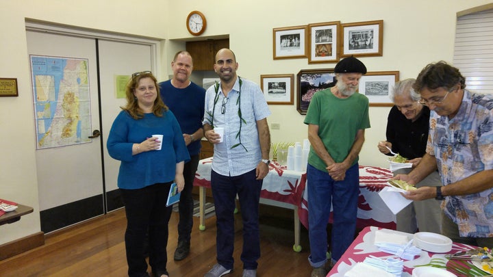 Steven Salaita, flanked by Laura Lyons (Interim Dean, UHM College of Languages, Linguistics & Literature, and John Zuern, (professor, English dept. University of Hawaiʻi at Mānoa) on his right, and George Hudes, activist Jewish member of Hawaii Jewish Voice for Peace and Sabeel Hawaii, on his left.