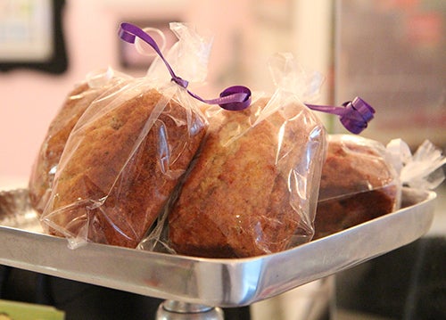 Mini loaves of banana bread wait at the counter.