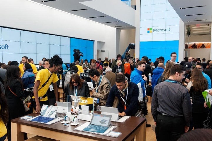 NEW YORK, NY - OCTOBER 26: Customers look at merchandise at Microsoft's first flagship store on Fifth Avenue on October 26, 2015 in New York City. Hundreds of eager customers waited outside to celebrate the opening of the three-story store that sells everything from laptops to tablets to Xboxes and video games. (Photo by Bryan Thomas/Getty Images)