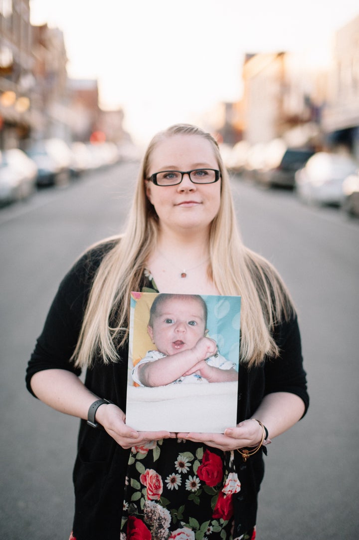 Betsy Cummings with a photo of her son, Dylan.