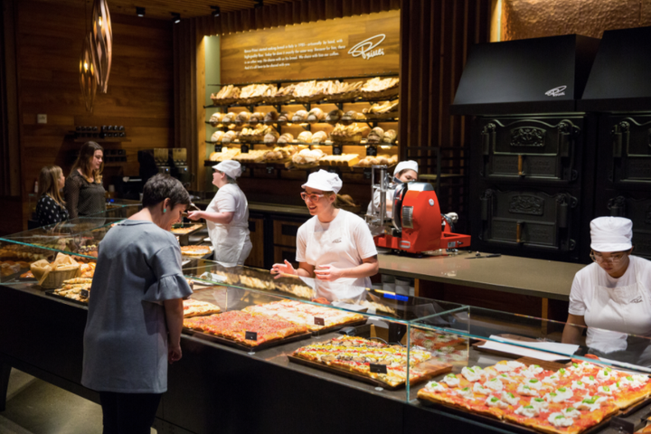 Visitors shop a range of fresh-baked goods at Princi, the new Starbucks-owned bakery and cafe in Seattle.