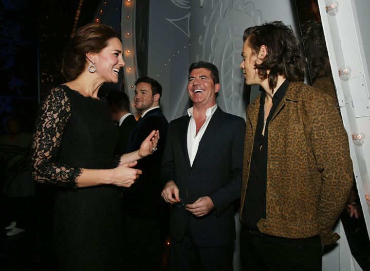 Catherine, Duchess of Cambridge meets Simon Cowell and Harry Styles of One Direction at the end of The Royal Variety Performance at the London Palladium on 13 November 2014.