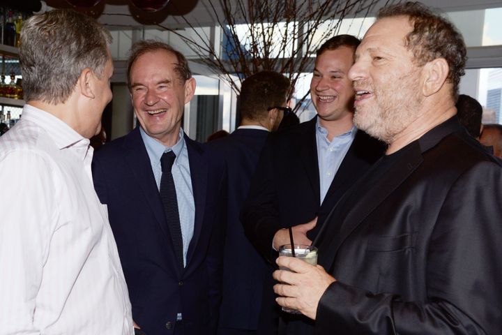 New York Times publisher Arthur Sulzberger, left, lawyer David Boies, a guest and studio executive Harvey Weinstein attend a cocktail party in New York City in 2014.