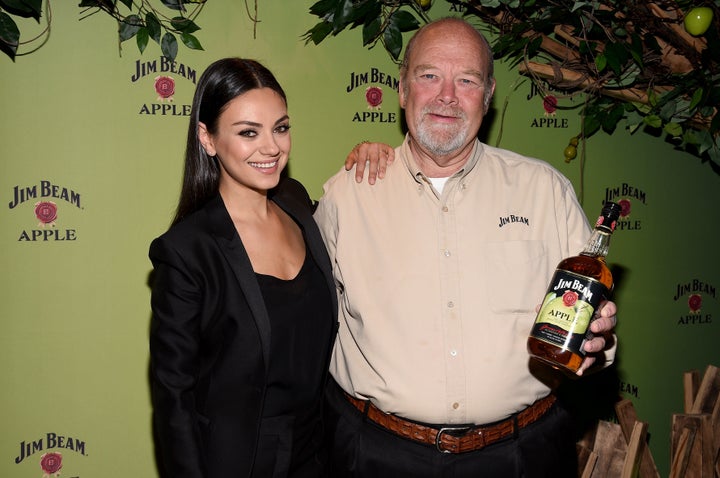 Mila Kunis pictured with Fred Noe, seventh generation Jim Beam Master Distiller, at a Jim Beam Apple launch event on Oct. 20, 2015 in New York City.