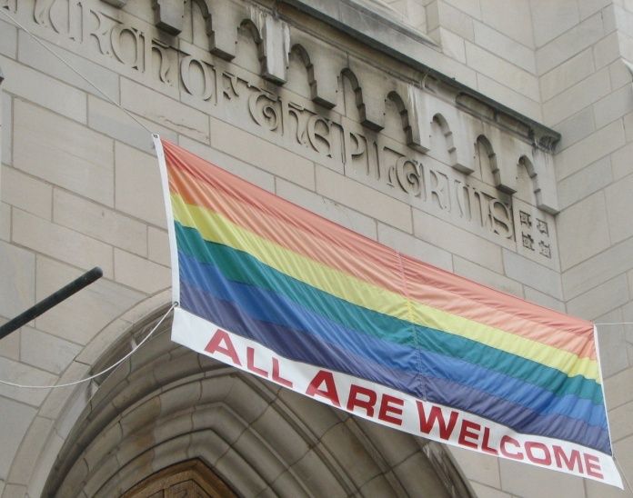  Portal of the Church of Pilgrims, in Washington, DC, with a LGBT banner. 