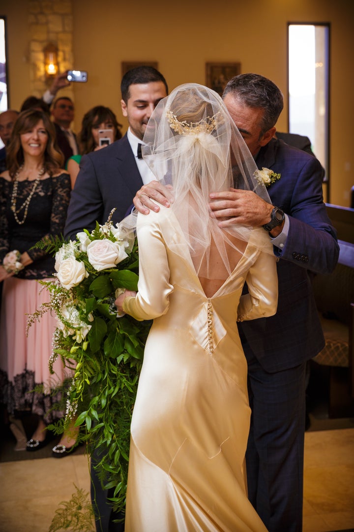 Pilar at her wedding ceremony at St. John Maron Church in Orange, California. In this photo, you can see the back of the dress, which was changed to a deep V before her mother Marta's wedding in 1983. 