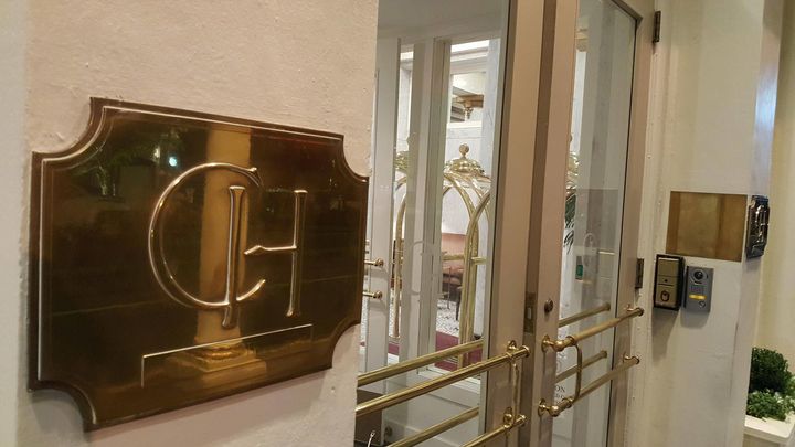 <p>polished brass and clear glass at The Capital Hotel</p>