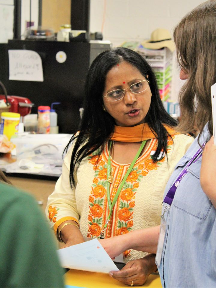 Doli Chaudhuri (India) leads students at Ashe County High School in an interactive project on genetics  