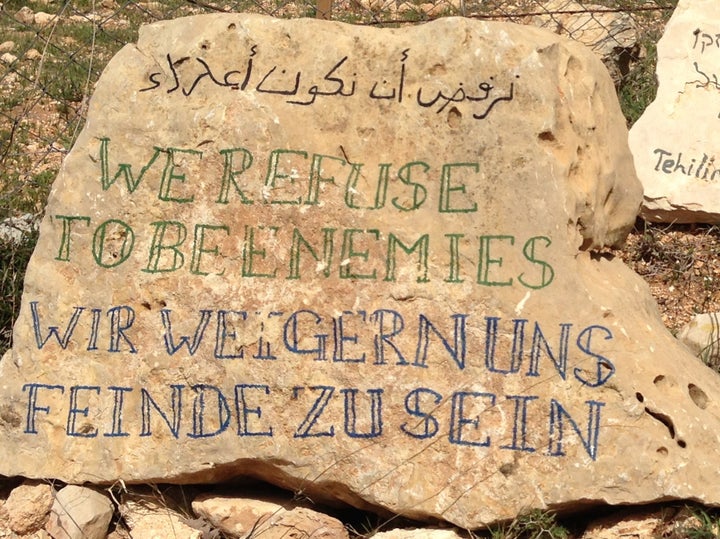 Plaque in the farm of a Palestinian family that is frequently threatened by Israelis living in nearby Jewish-only settlements southwest of Bethlehem. Credit: patheos.com