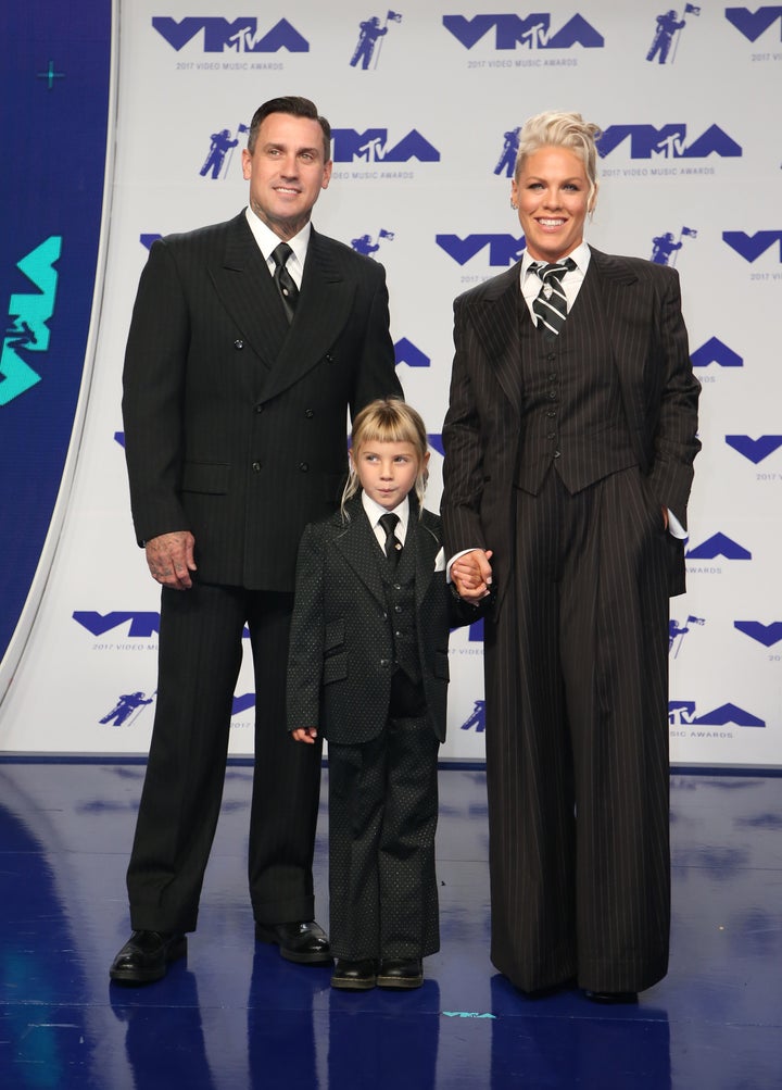 The trio wore matching suits. 