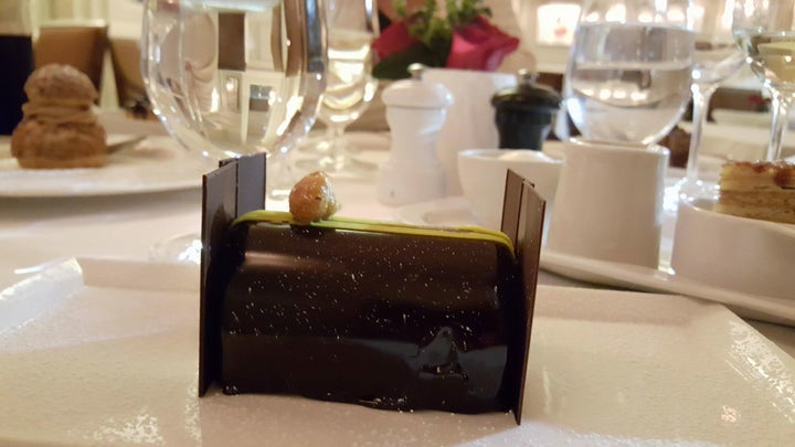 <p>To Joel, this is a chocolate cake. Served with pecan praline and lemon curd. Yes it was as amazing as it looks.</p>