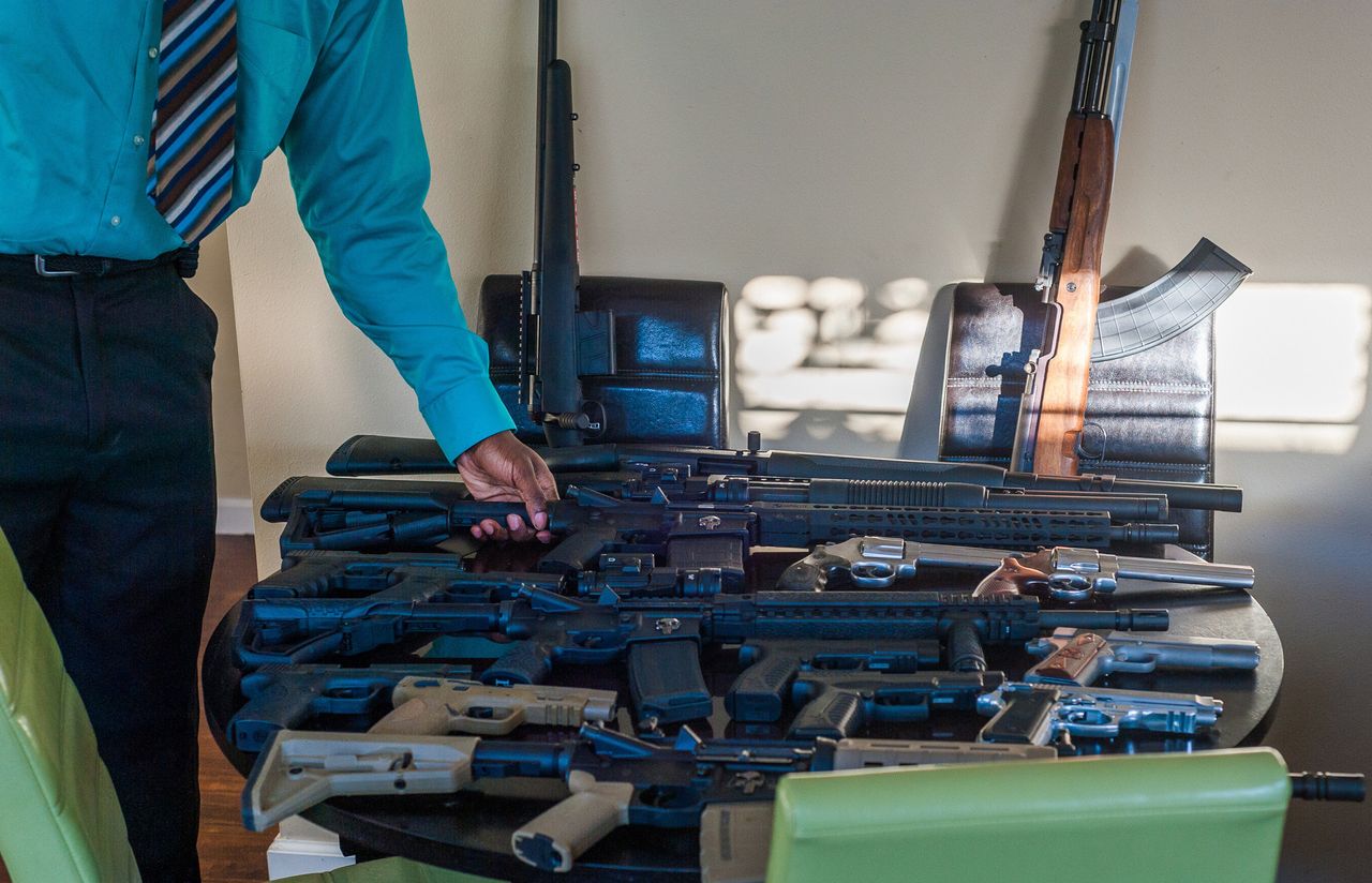 LeFlore and some of his gun collection.