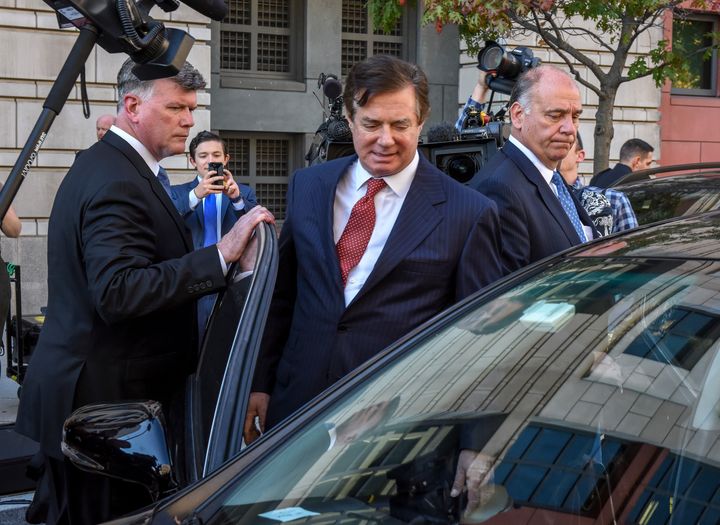 Manafort, center, departs U.S. District Court with his attorney Kevin Downing, left, on Nov. 2, 2017, in Washington, D.C.