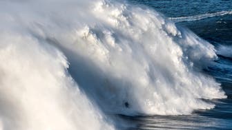 NAZARE, PORTUGAL - NOVEMBER 08: British big wave surfer Andrew Cotton drops a wave during a surf session at Praia do Norte on November 8, 2017 in Nazare, Portugal. Cotton suffered a broken back after the wave knocked him off his board. (Photo by Octavio Passos/Getty Images)