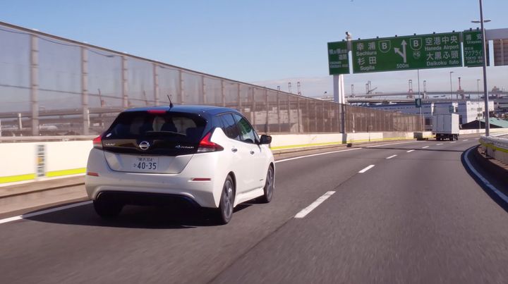 Nissan Leaf on a the highway in Japan. Japanese roads are very well maintained and provide the perfect environment for self-driving and driver assist features. 