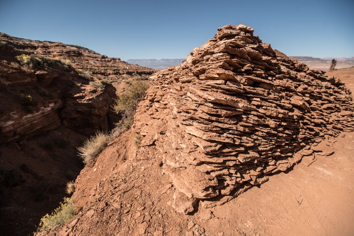 <p>While Rampage began as a natural terrain run down a mountain, things have changed. Teams of builders now spend nearly two weeks constructing lines for each individual rider. Here, what looks like a crude rock wall is actually the base for the landing of a 60 foot gap jump.</p>