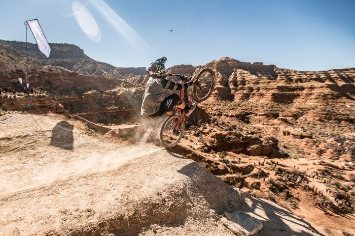 <p>Another former Rampage champ, Cam Zink leaves the ground as he backflips down a 60 foot plunge to the landing below.</p>