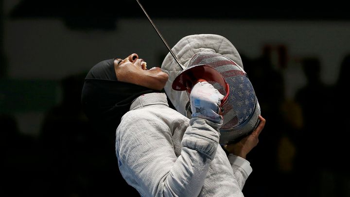 Ibtihaj Muhammad celebrating after she won the women's sabre team semifinals in the 2016 Olympics in Rio de Janeiro. 