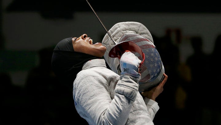 Ibtihaj Muhammad celebrating after she won the women's sabre team semifinals in the 2016 Olympics in Rio de Janeiro.