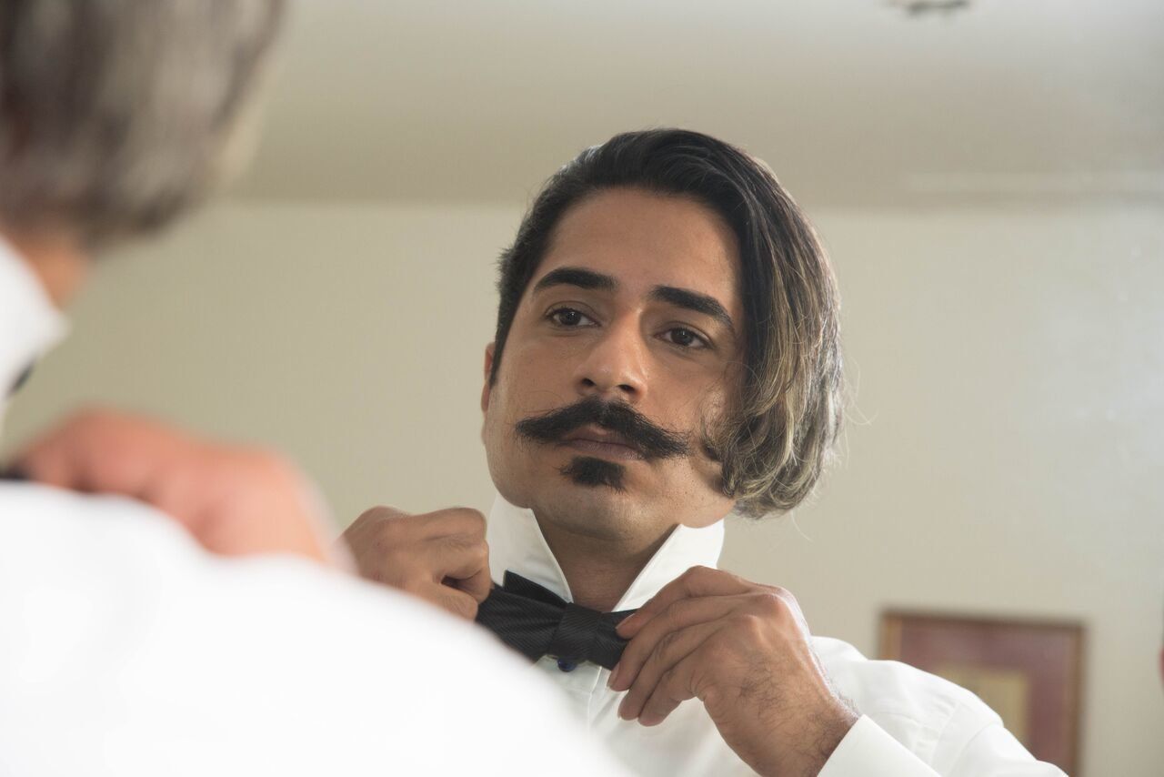 Haghjoo adjusts his bow tie before the wedding ceremony.