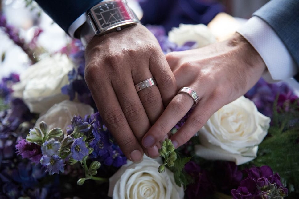 Haghjoo and Nia hold hands after their wedding.