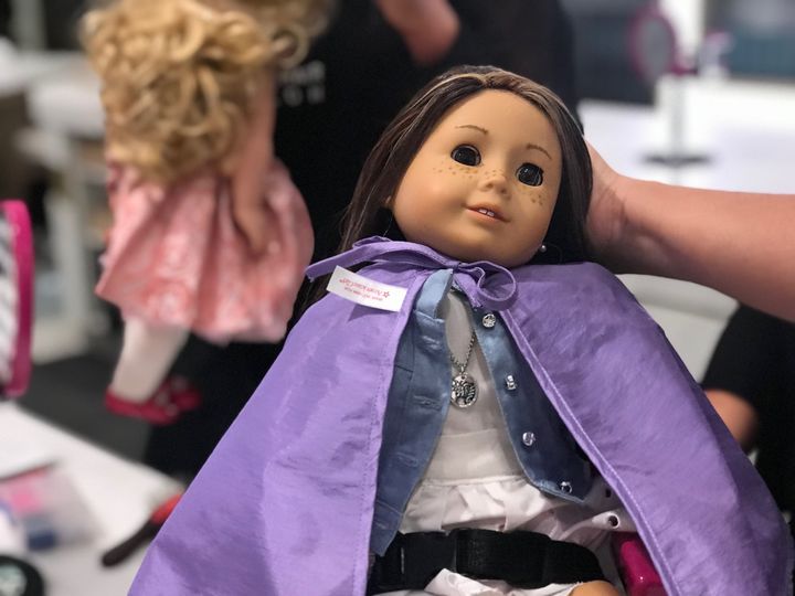 Doll salon clients upstairs at the new American Girl Place. 